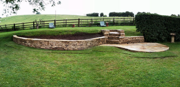 Raised bed with steps and patio